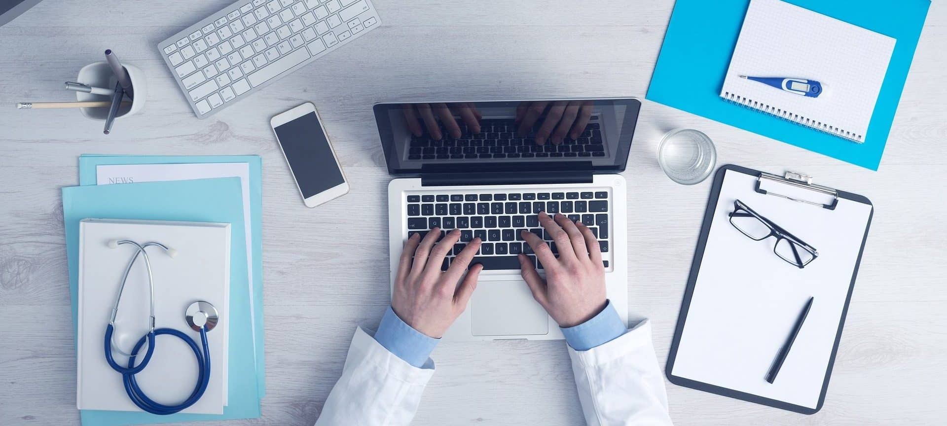 medical-doctor-filling-out-form-online